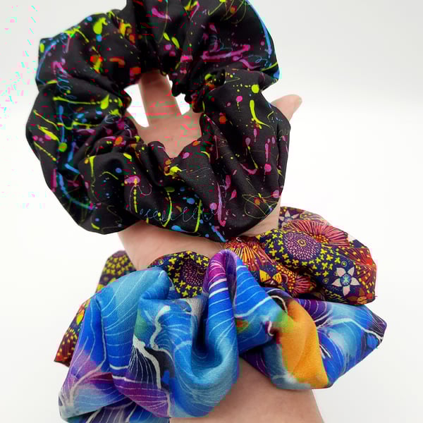 Large scrunchies,  set of 3. Black neon, blue petal fabric.  