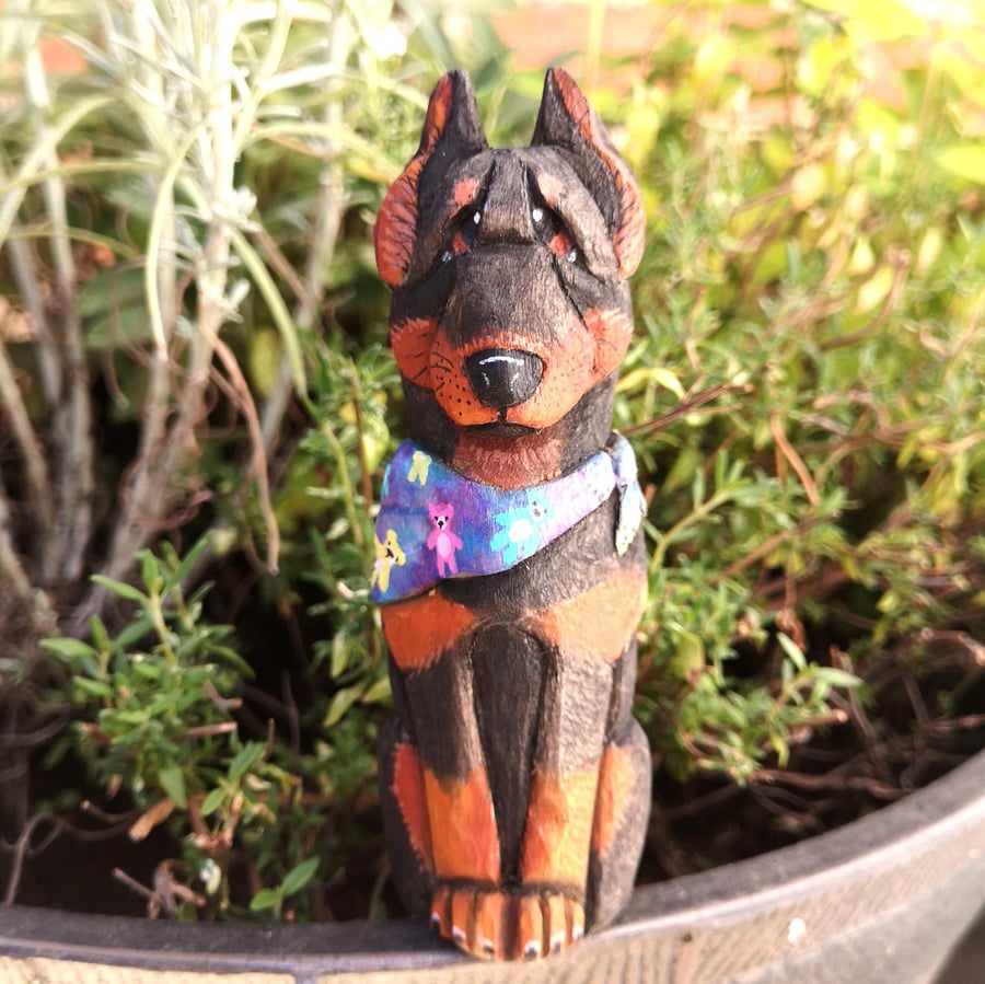 Hand-carved and painted Donut the Doberman