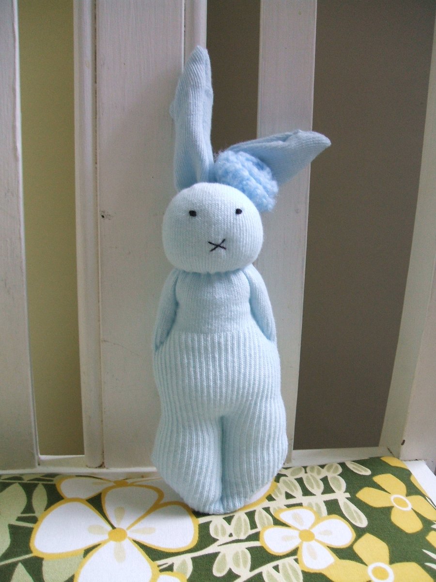 Cute bunny soft toy with blue flower