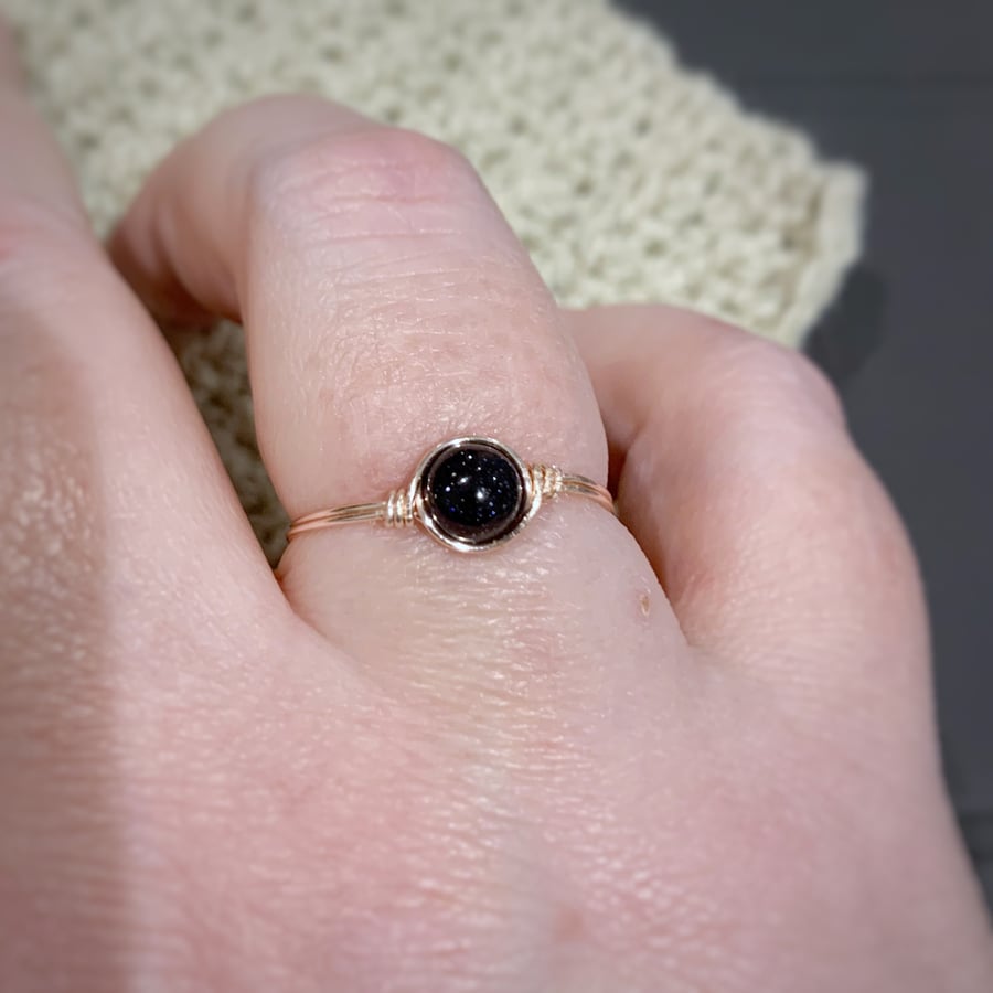 Blue goldstone gemstone ring in rose gold coloured wire