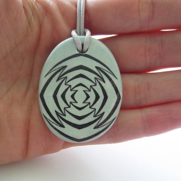 Jagged Target Design Oval Ceramic Pendant on Grey Cord with Lobster Clasp