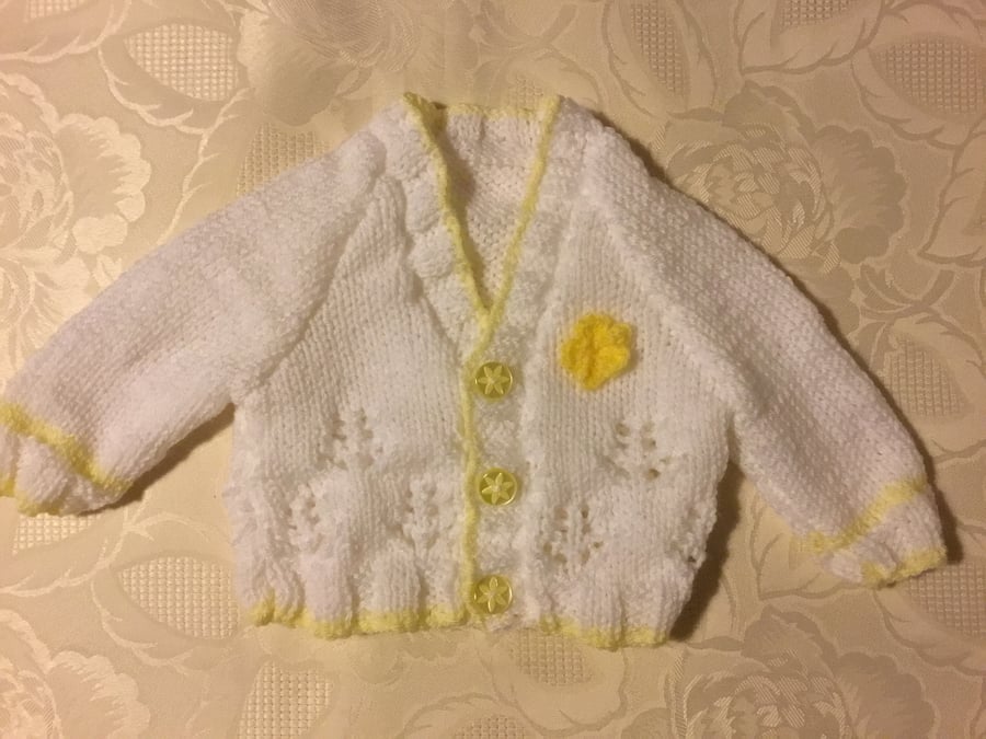 Hand Knitted Baby girls cardigan in a white yarn with yellow trim 0-3 months 