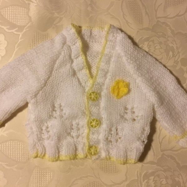 Hand Knitted Baby girls cardigan in a white yarn with yellow trim 0-3 months 