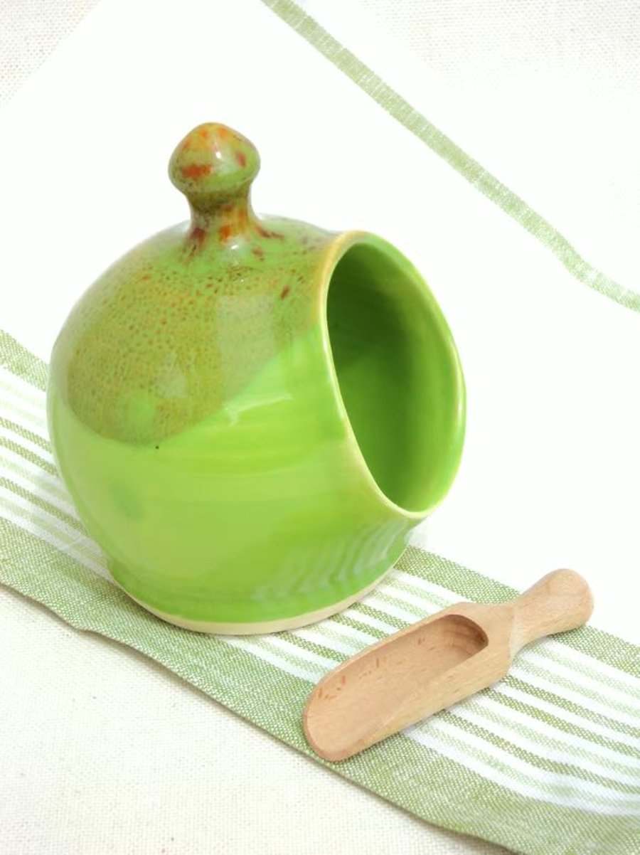 Small Salt Pig, handthrown pottery in vibrant Green glaze with a wooden scoop.