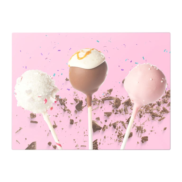 Toffee Lollies & Chocolate Sprinkles On Pink Glass Chopping Board