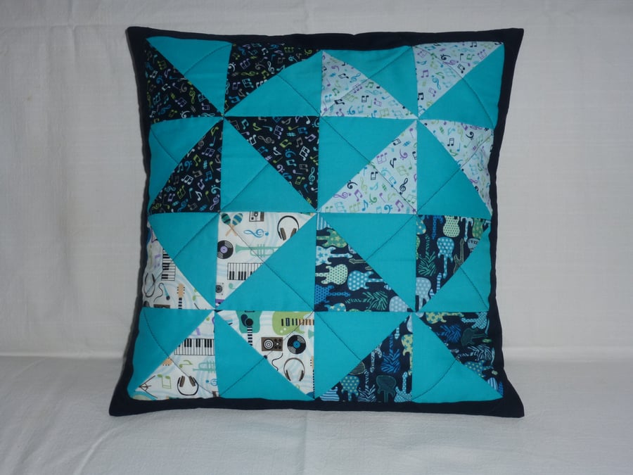 Turquoise pinwheel cushion