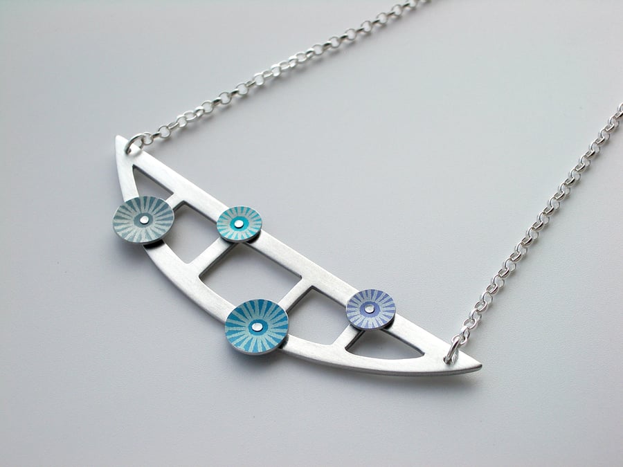 Semi-circle pendant necklace with rivetted circles