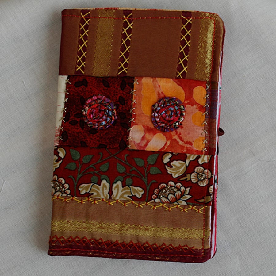 Claret and gold, 'sticky notes' type notebook