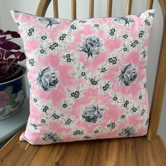 Floral cushion cover in a pretty wild rose print in pink and grey, 40cm x 40cm