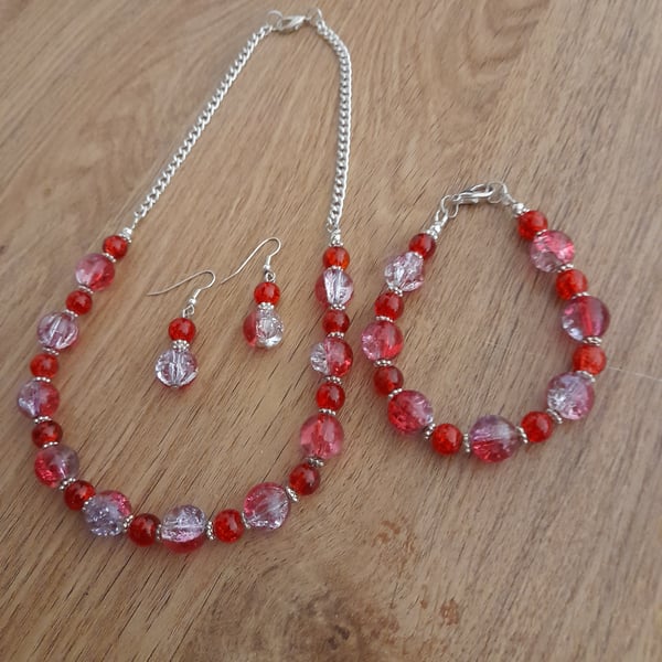 SHADES OF RED, PINK AND CLEAR CRYSTAL NECKLACE, BRACELET AND EARRING SET.