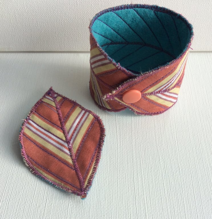 Textile, reversible feather bracelet and leaf brooch