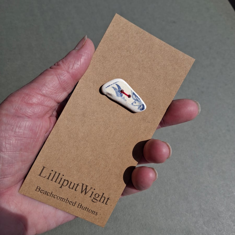 Large blue and white sea pottery button