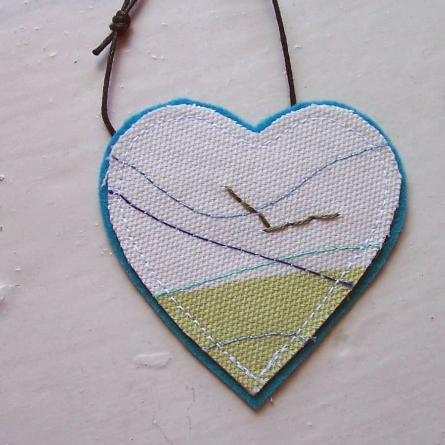 Textile necklace, heart shaped, hand and machine embroidered  - Gannet