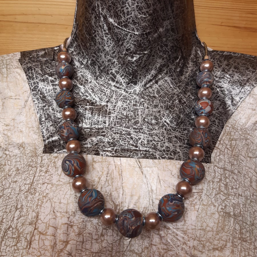 Elegant bronze, turquoise multi coloured necklace