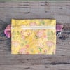 Floral zip pouch with swivel clip