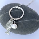 Silver fish pendant with pearl