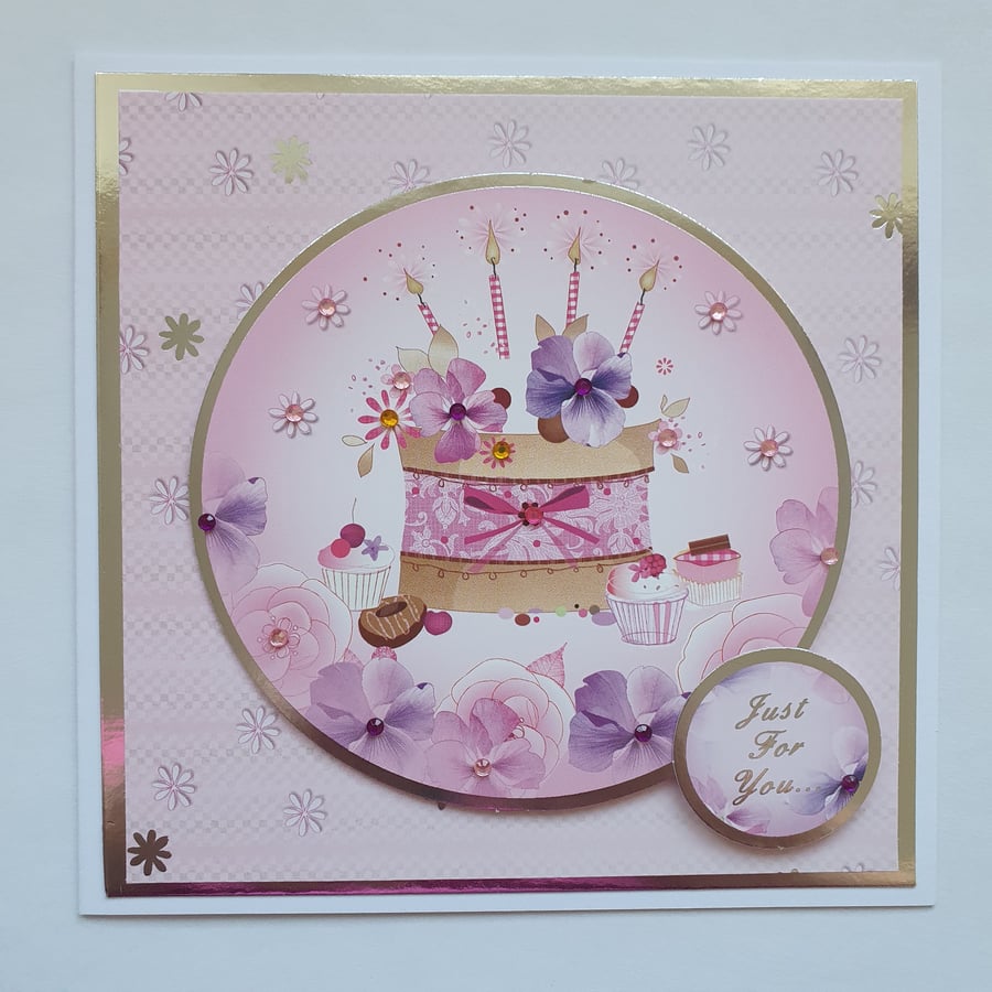 A cake and candles foil embossed birthday card