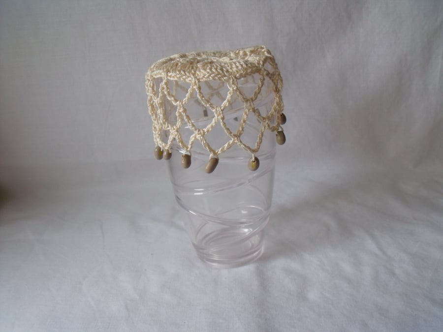 vintage style crocheted beaded doily jug cover to repel bugs when outdoors 