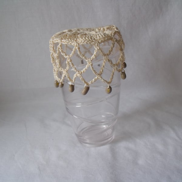 vintage style crocheted beaded doily jug cover to repel bugs when outdoors 