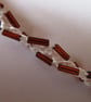 A crocheted necklace in white cotton with bronze bugle beads - Image 2
