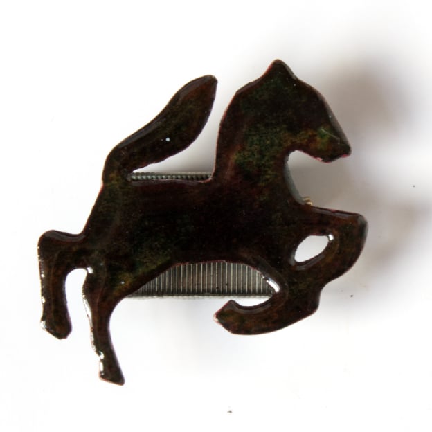 enamelled brooch: black horse