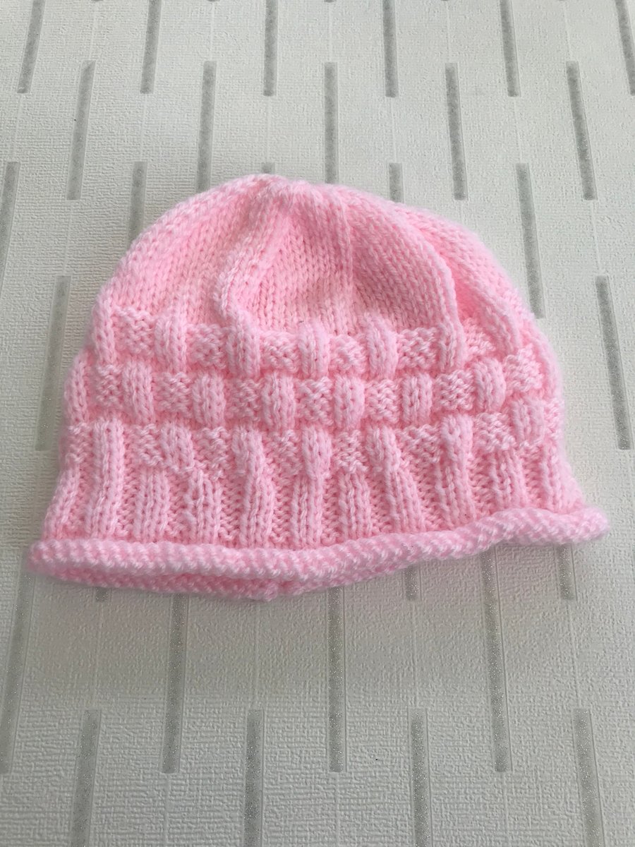 Pink hat with a patterned border