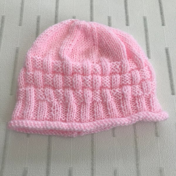 Pink hat with a patterned border