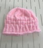 Pink hat with a patterned border - Image 1