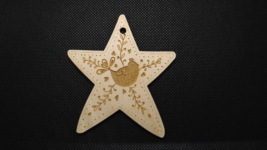 Folk Art bird, on a wooden star hanging decoration