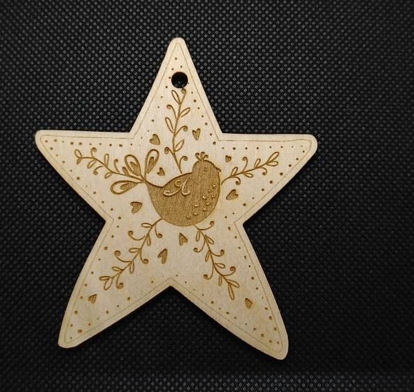 Folk Art bird, on a wooden star hanging decoration