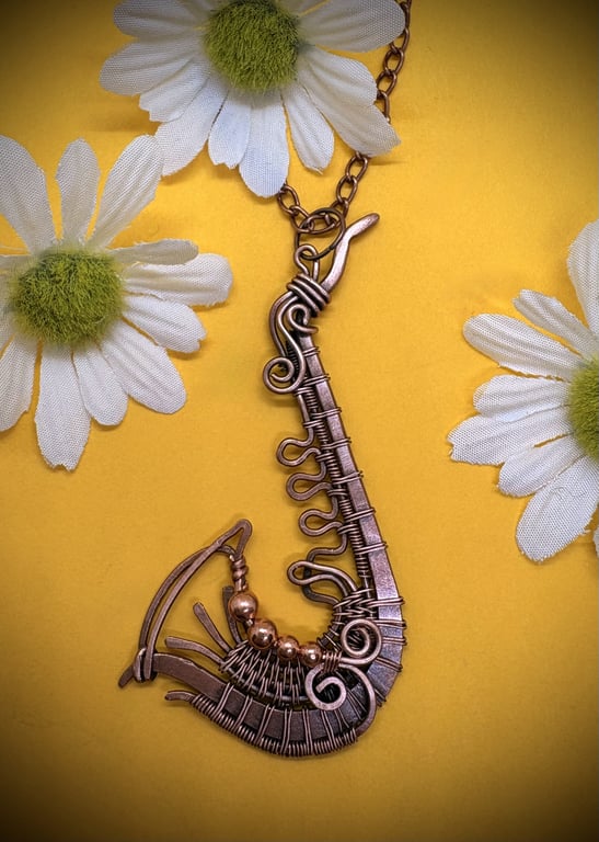 Antique copper wire wrapped Saxophone pendant