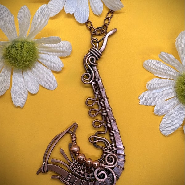 Antique copper wire wrapped Saxophone pendant