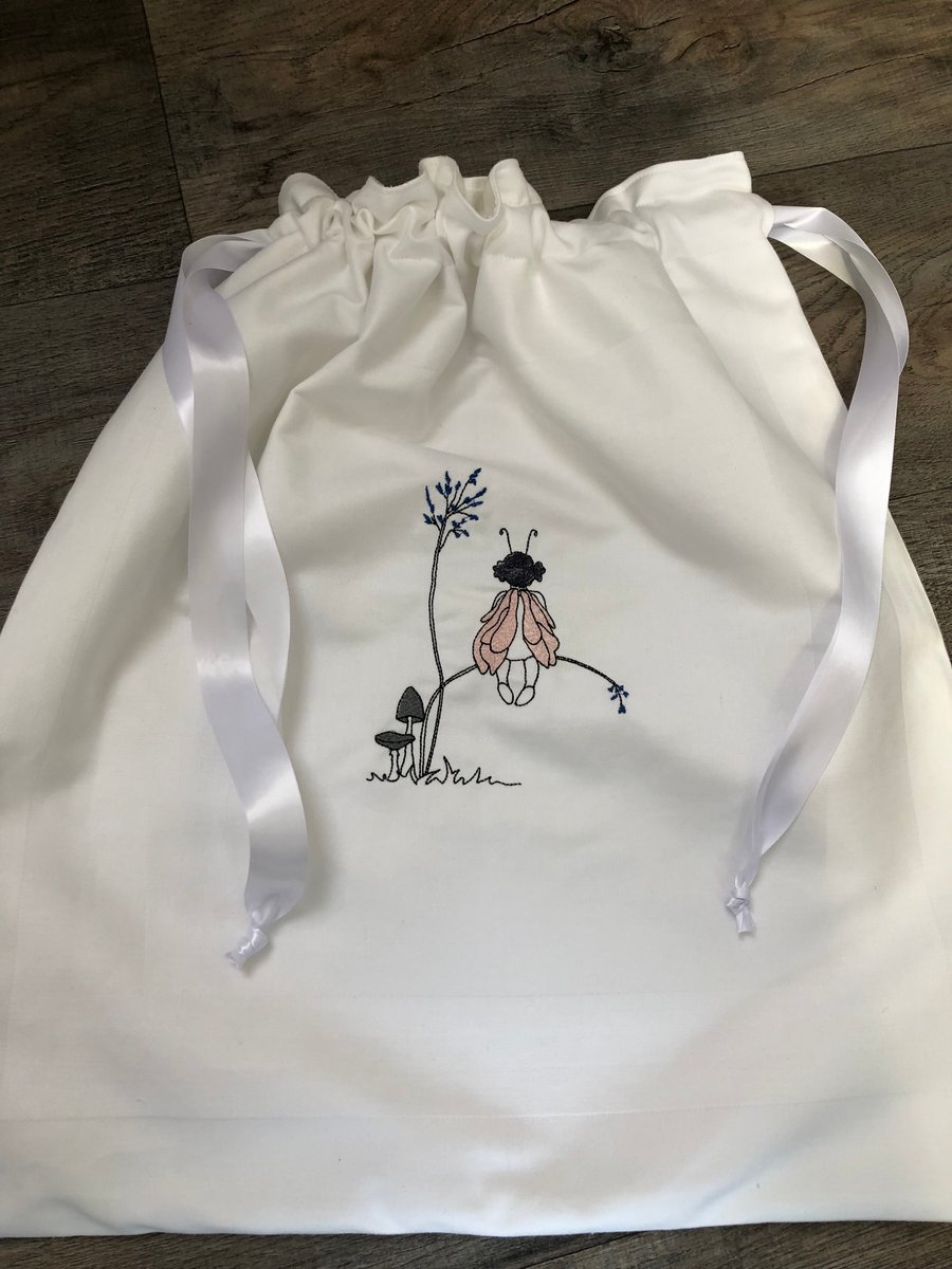 Machine embroidered laundry bag