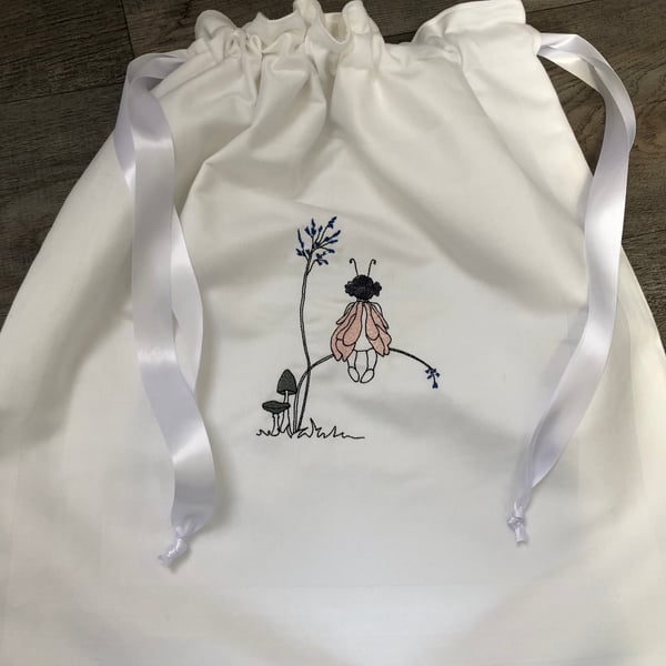 Machine embroidered laundry bag