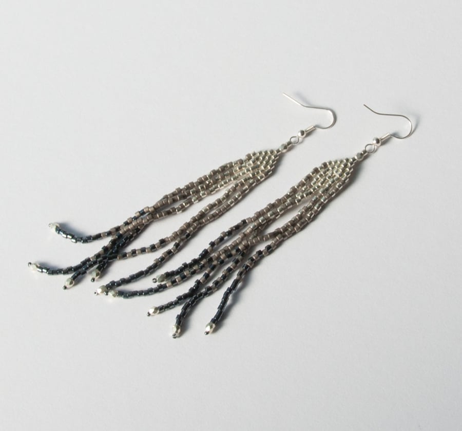 Steel feather long beadwoven earrings