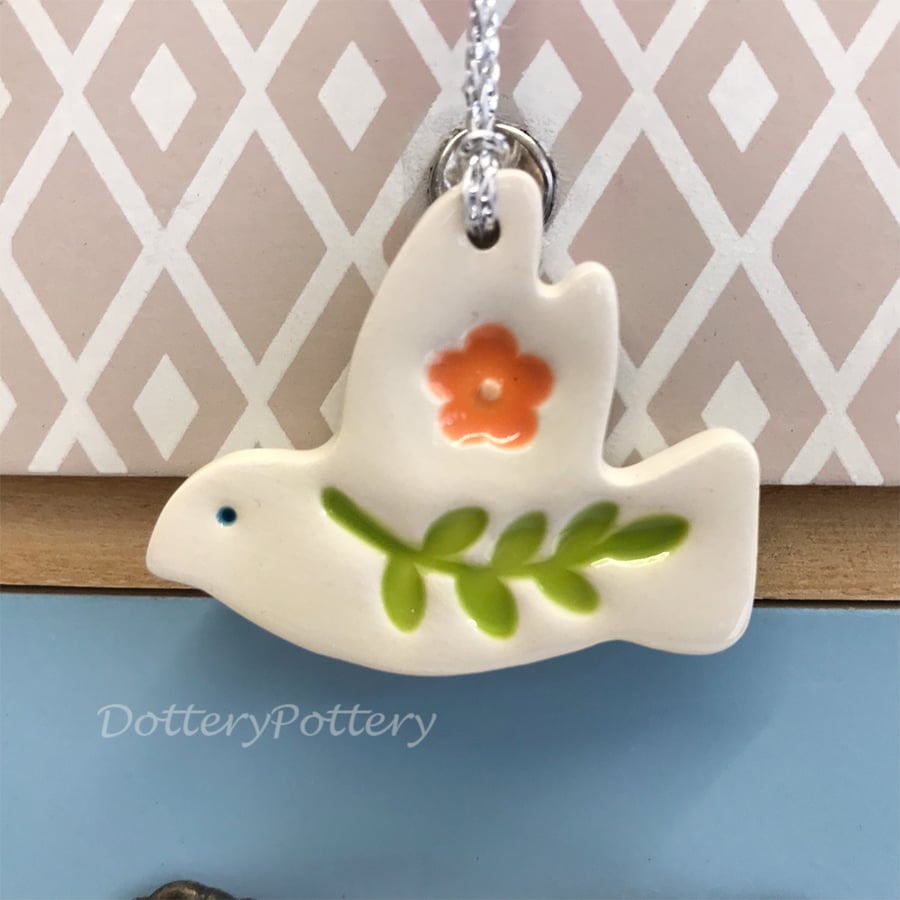 Teeny ceramic dove decoration with leaves and orange flower
