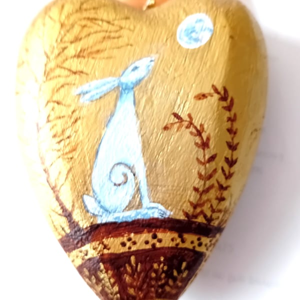 Hare on a chunky golden heart shape  hand painted