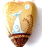 Hare on a chunky golden heart shape  hand painted