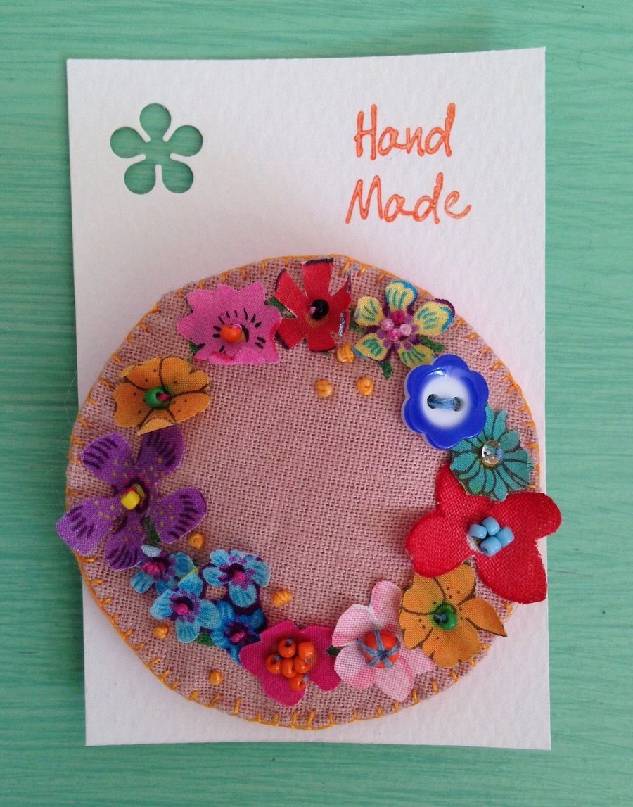 Pink flowery wreath brooch