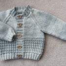 Newborn baby boys cardigan hand-knitted in a  soft mixed greyish blue baby yarn 