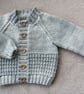Newborn baby boys cardigan hand-knitted in a  soft mixed greyish blue baby yarn 