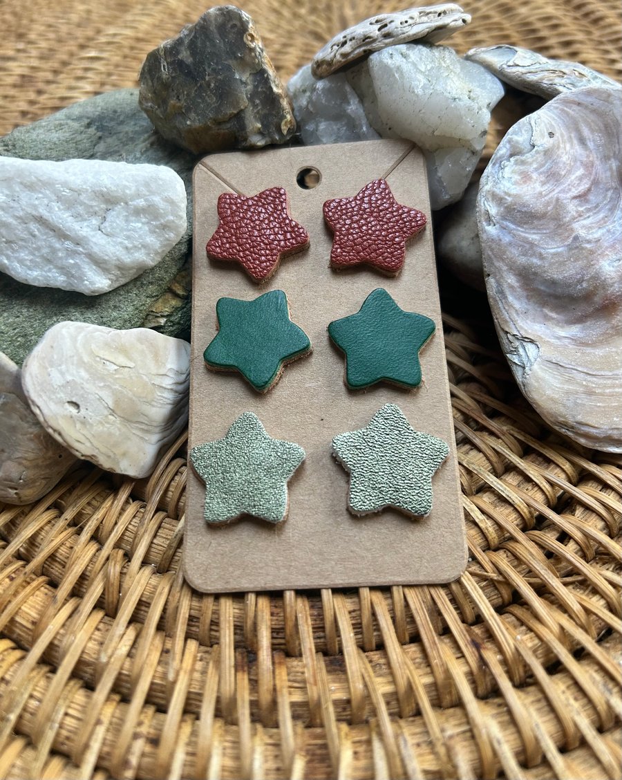 Three pairs of leather star earrings
