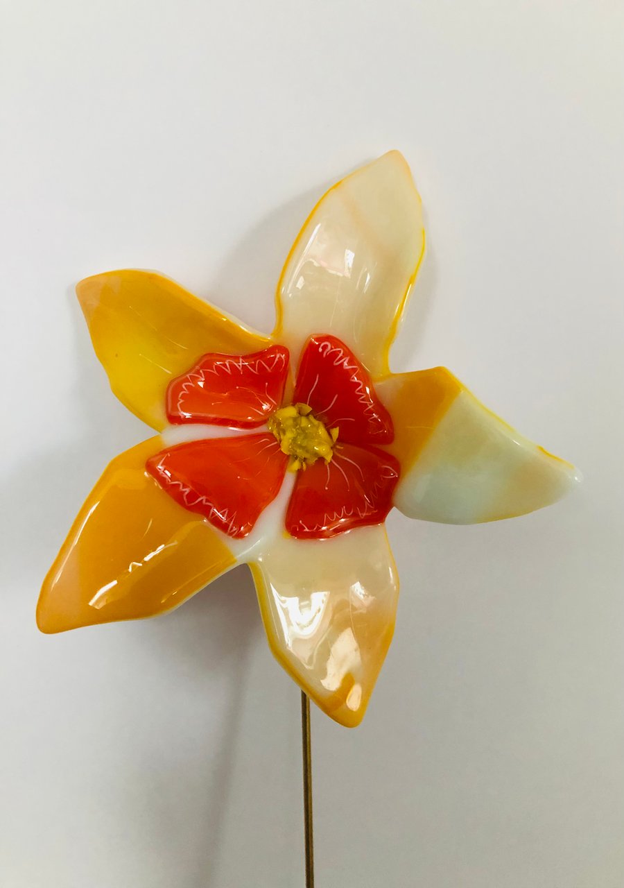 Glass fused yellow flower on brass rod, daffodil style