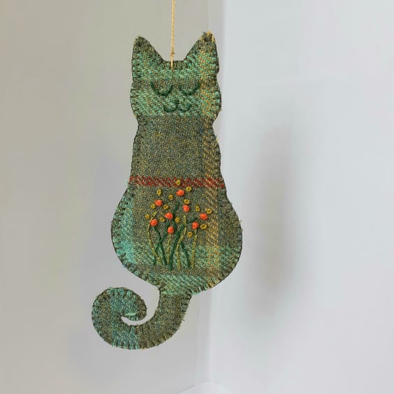 Smiling cat hanging ornament in wool tweed with embroidered tummy