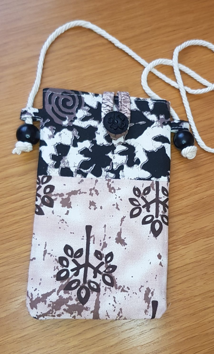 Indian block print fabric mobile phone pouch in black and brown prints