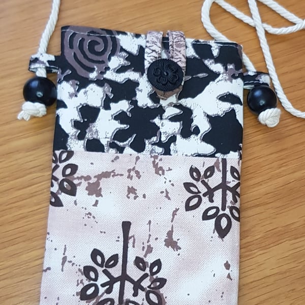 Indian block print fabric mobile phone pouch in black and brown prints