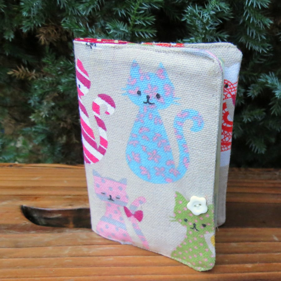 Cats,  A passport cover with a whimsical cats design.