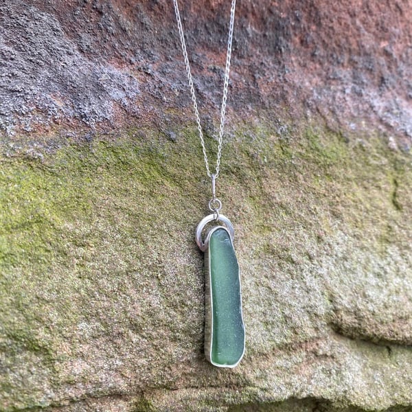 Elegant sea glass pendant in bottle green, sterling silver setting and chain