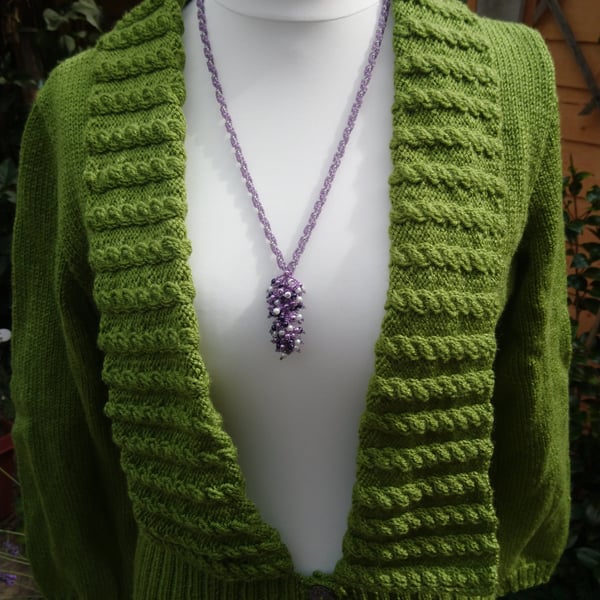 Hand knitted ladies cardigan with cable stitch collar