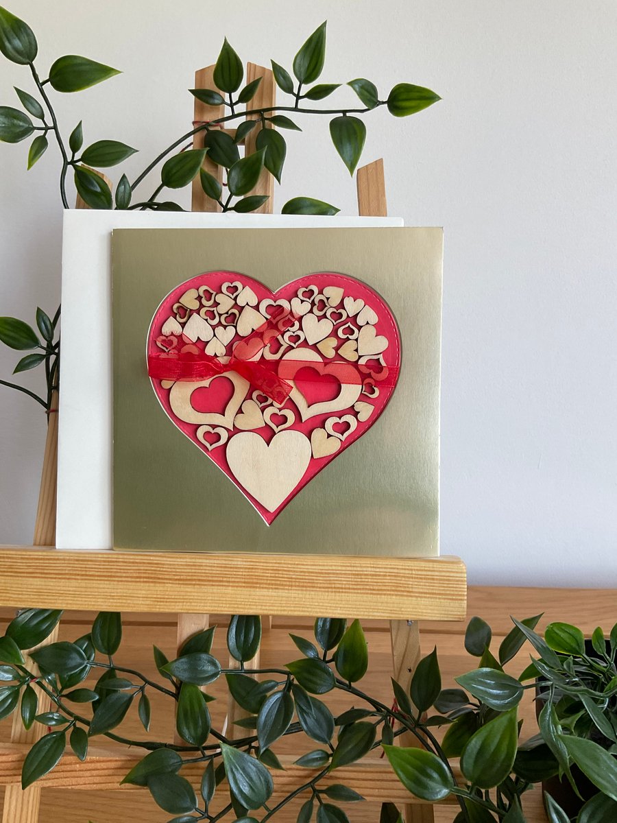 Gold and red heart greetings card